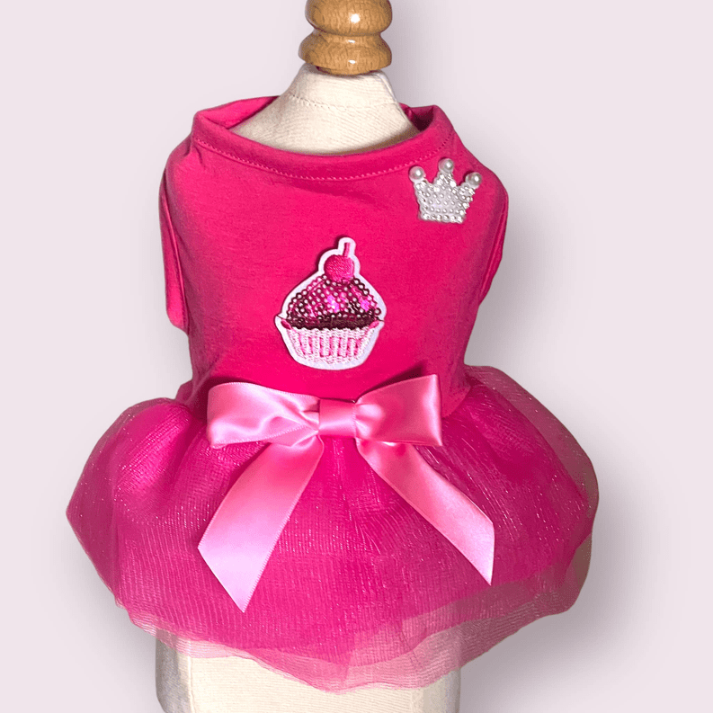 Pink 🐶 It's My Pawty- Princess Party Dog Dress 🎉 with a cupcake design and a tulle skirt on a mannequin, featuring Velcro closure by Pets Paradise.